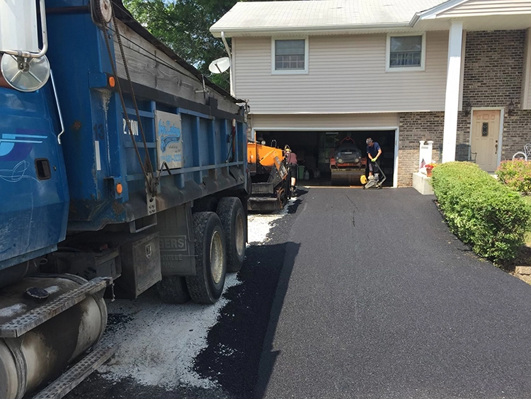 John Zarlengo Asphalt Paving crew paving residential driveway